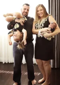 adam-playing-with daughters-and-wife