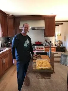 Men standing in kitchen
