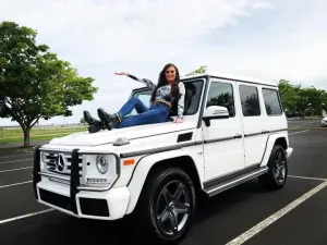 lindsey-sitting-on-car