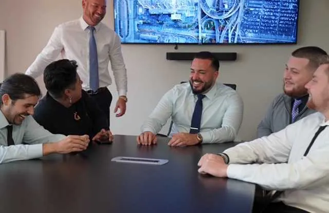 karl-laughs-with-team